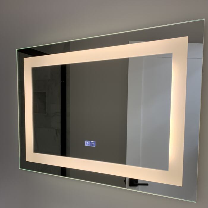 Backlit bathroom mirror with a glowing frame